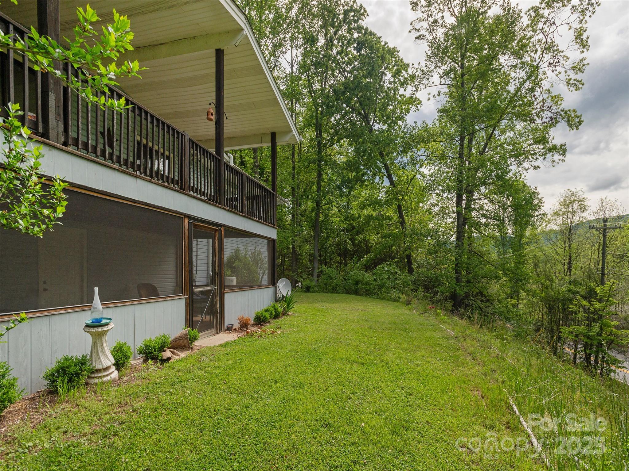 61 West Lake View Road Hendersonville, NC 28739 - Photo 34 of 37 a balcony with tall trees