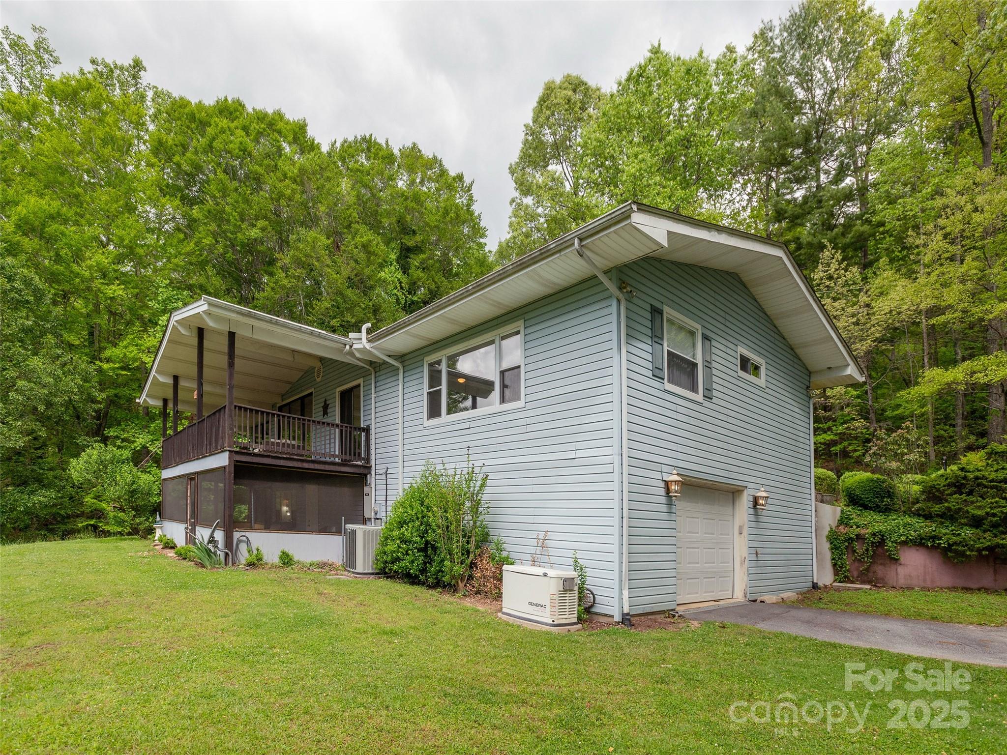 61 West Lake View Road Hendersonville, NC 28739 - Photo 35 of 37 a front view of a house with a garden
