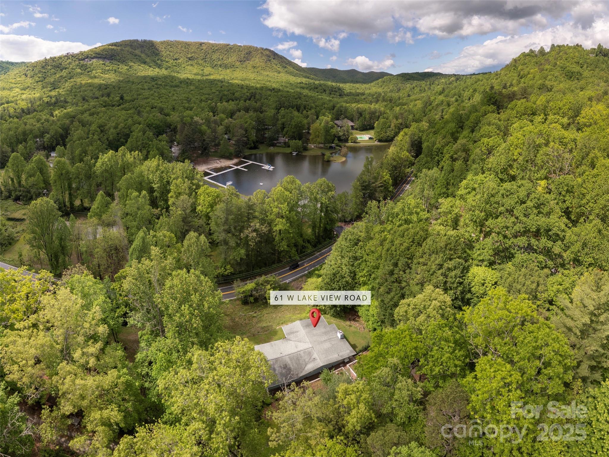 61 West Lake View Road Hendersonville, NC 28739 - Photo 37 of 37 a view of a lake with a mountain in the background