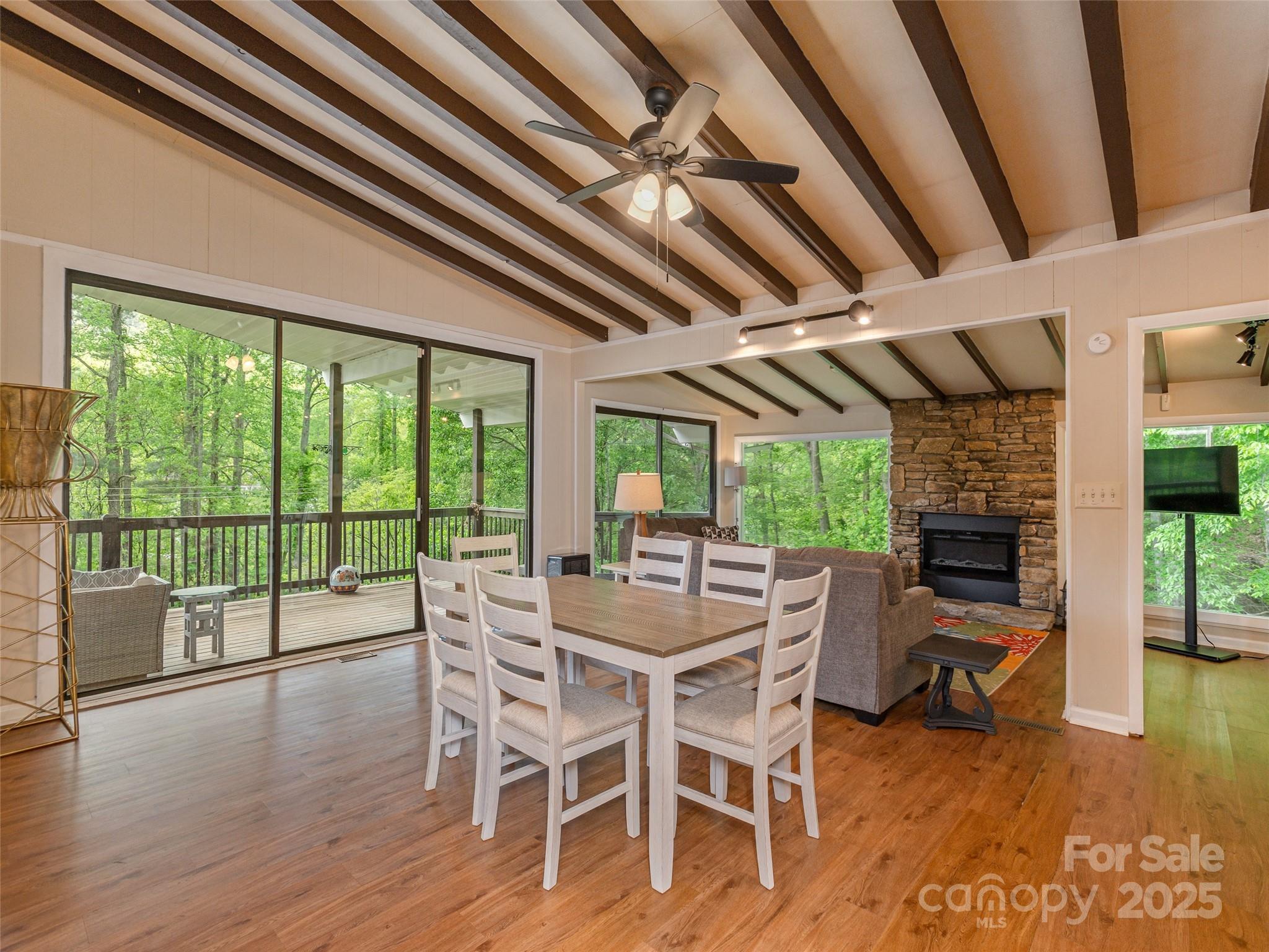 61 West Lake View Road Hendersonville, NC 28739 - Photo 4 of 37 a view of a dining room with furniture window and wooden floor