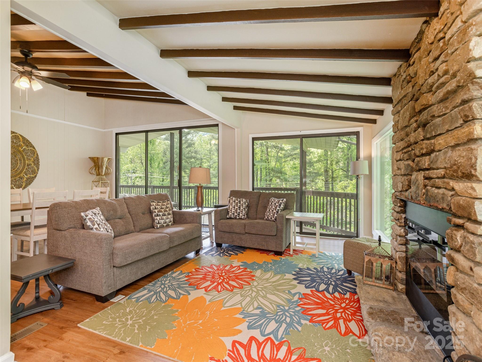 61 West Lake View Road Hendersonville, NC 28739 - Photo 6 of 37 a living room with furniture and a floor to ceiling window