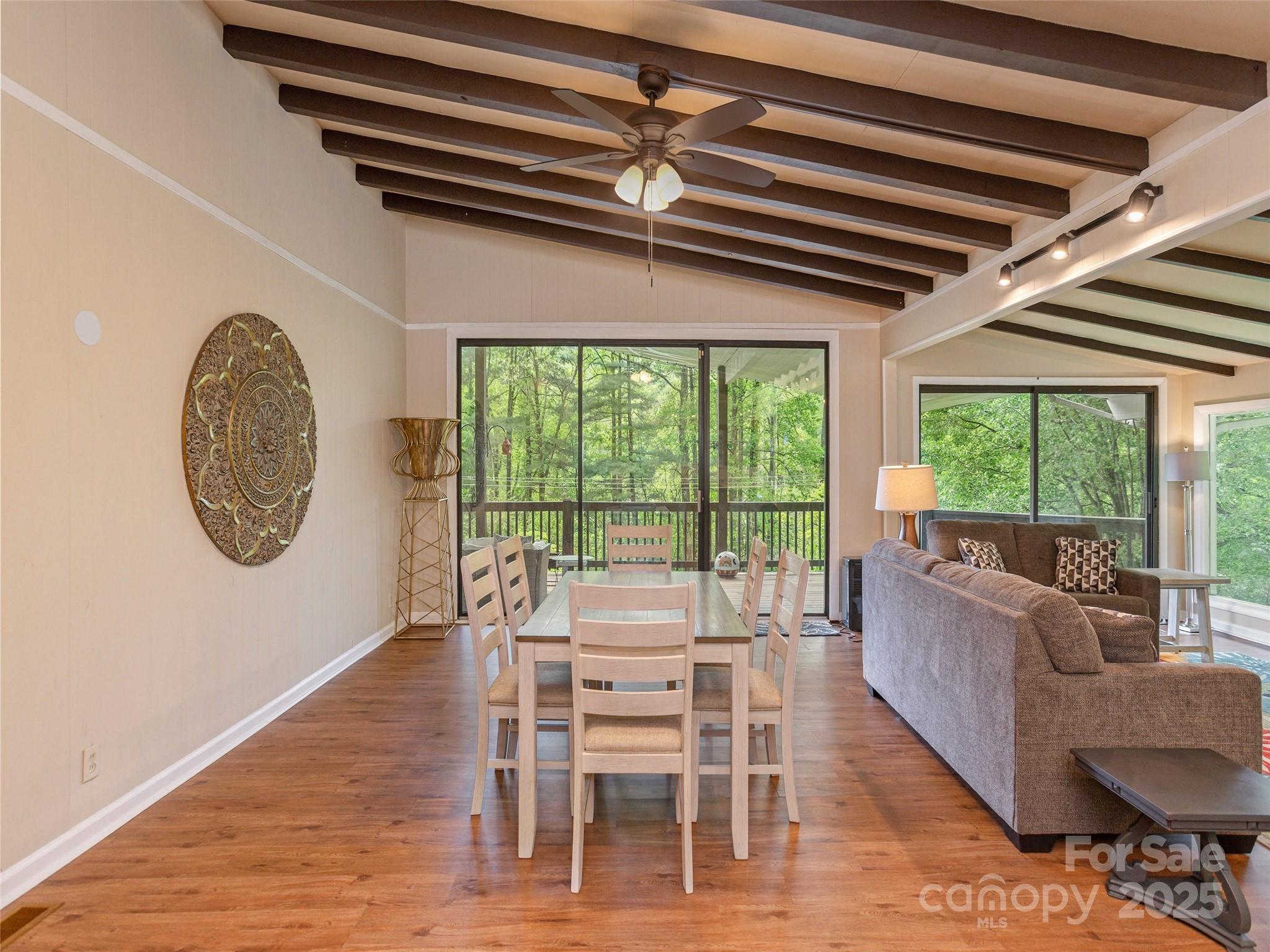 61 West Lake View Road Hendersonville, NC 28739 - Photo 9 of 37 a dining room with furniture a rug and a large window