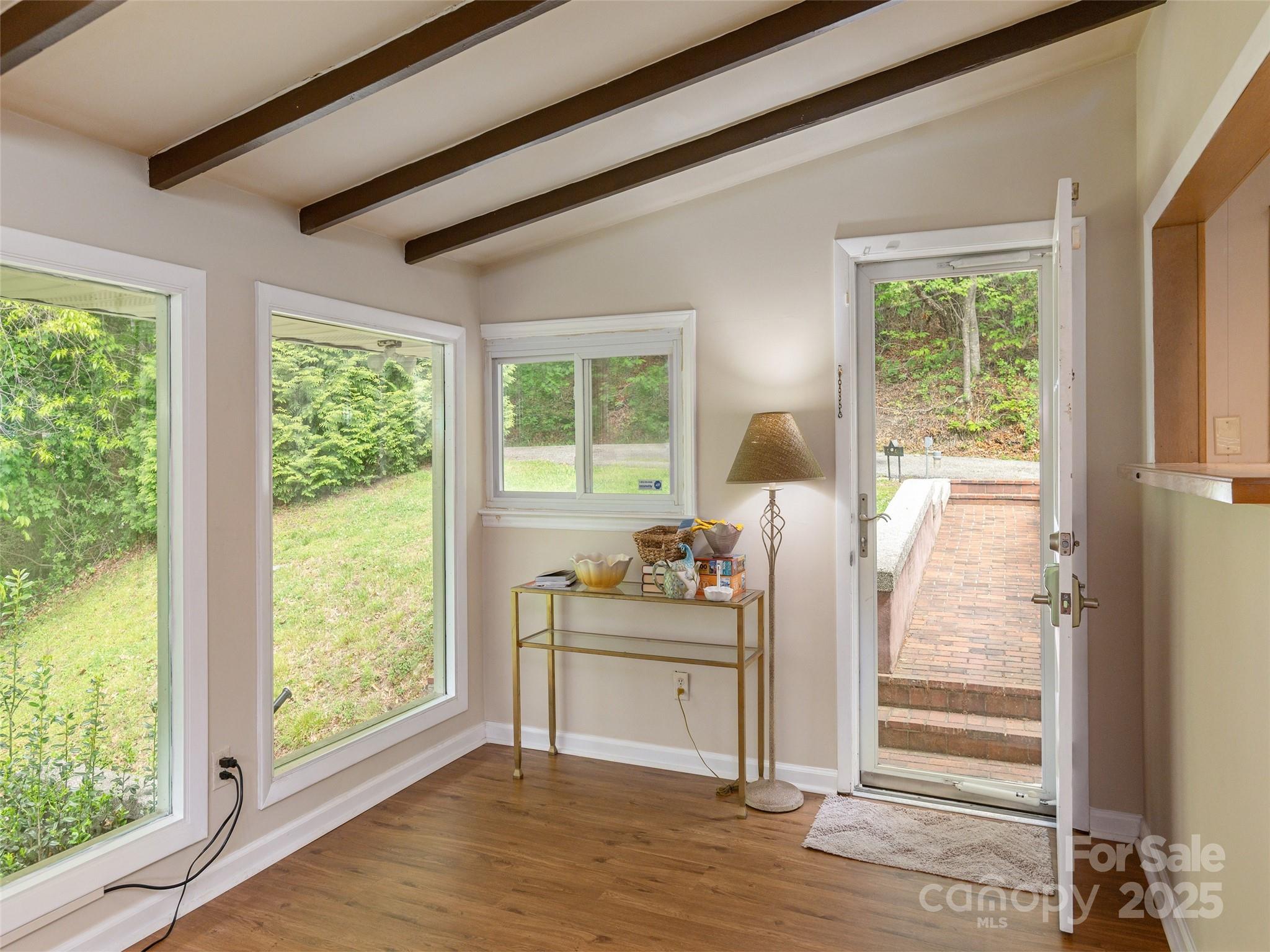 61 West Lake View Road Hendersonville, NC 28739 - Photo 10 of 37 a room with furniture and a large window