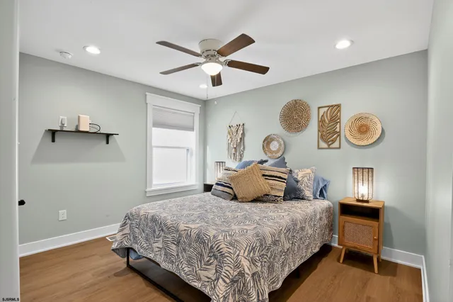 a bedroom with a large bed and a window