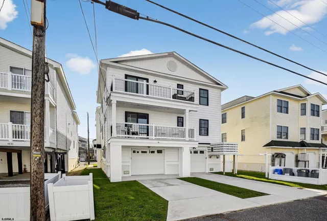 a aerial view of a house with a yard