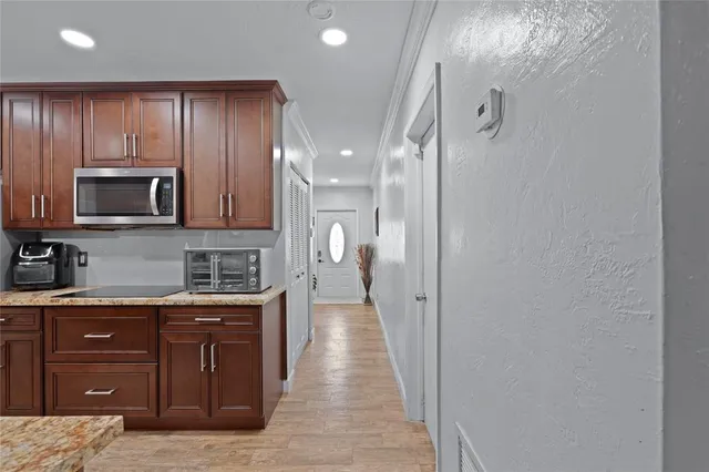 a view of a kitchen from the hallway