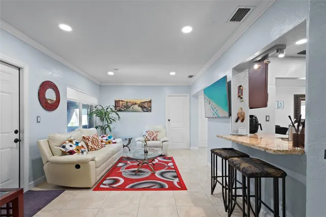 a living room with furniture and a large mirror