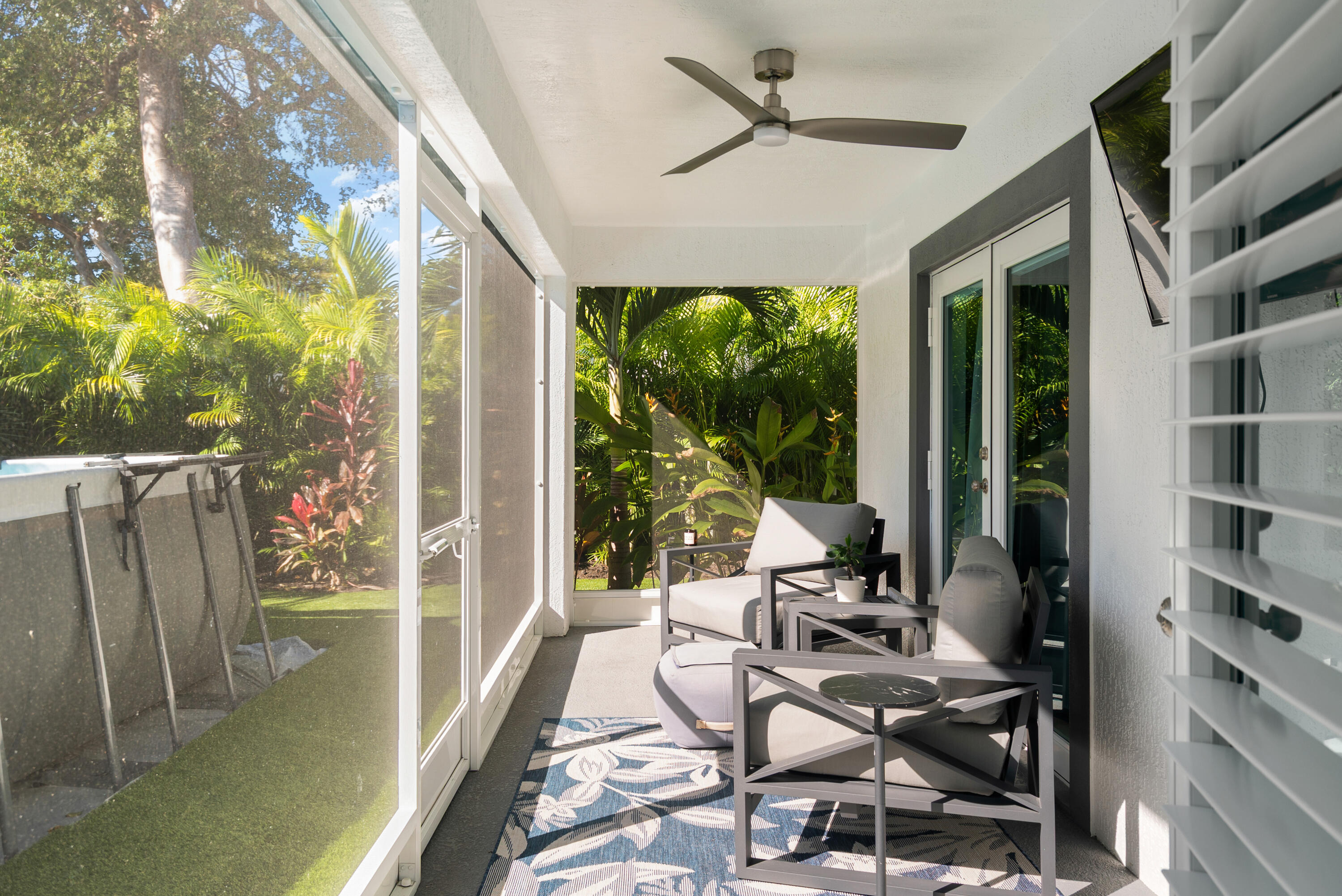37 Bonefish Avenue Key Largo, FL 33037 - Photo 21 of 22 a living room with furniture a floor to ceiling window and floor to ceiling window