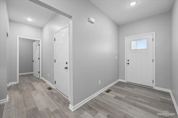 a view of room with wooden floor