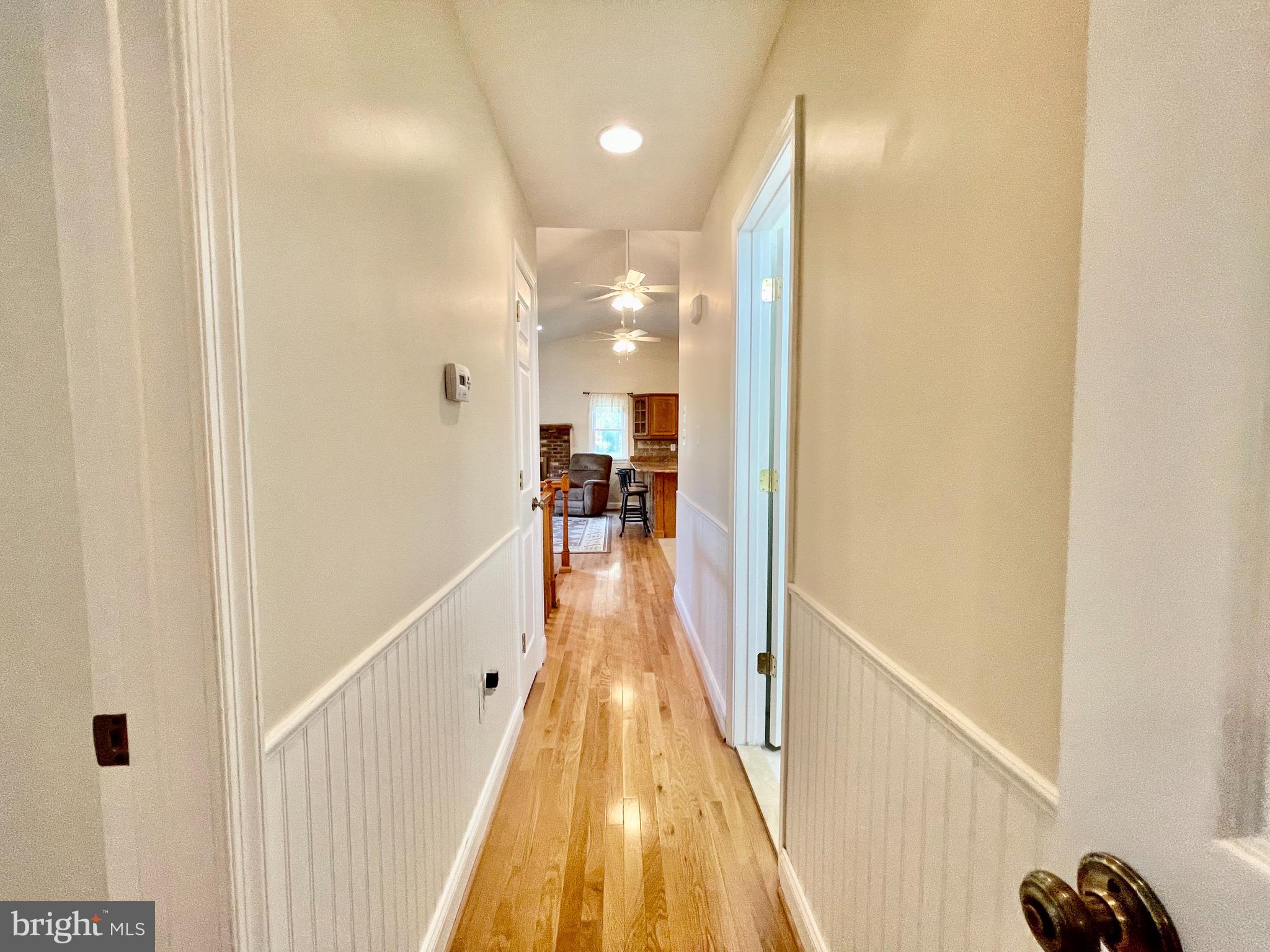 1270 Calvert Beach Road St. Leonard, MD 20685 - Photo 19 of 31 a view of a hallway with a couch