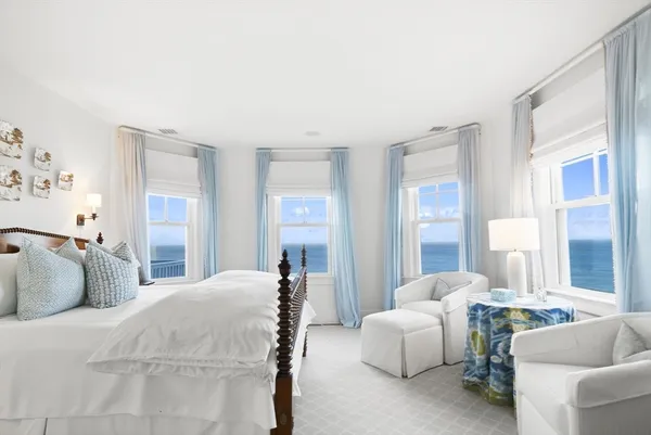 a bedroom with a bed and a couch