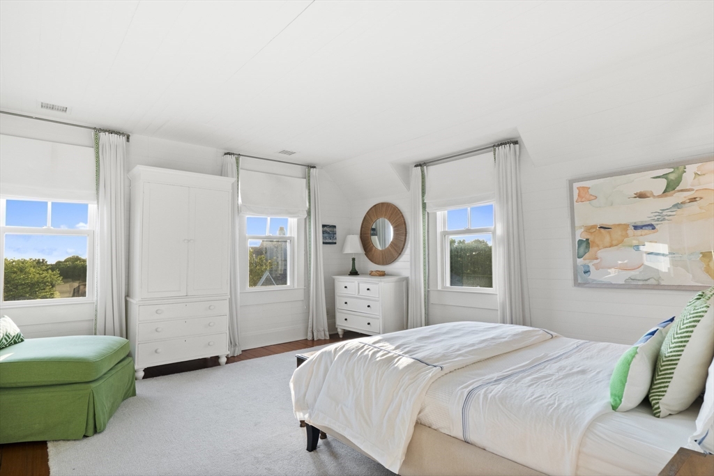 63 Baxter Road Nantucket, MA 02554 - Photo 17 of 21 a bedroom with a bed and a large window