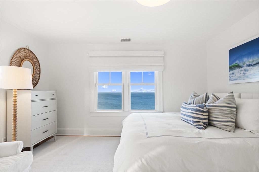 63 Baxter Road Nantucket, MA 02554 - Photo 18 of 21 a bedroom with a bed and a dresser