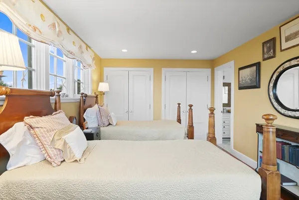 a bedroom with bed and a couch