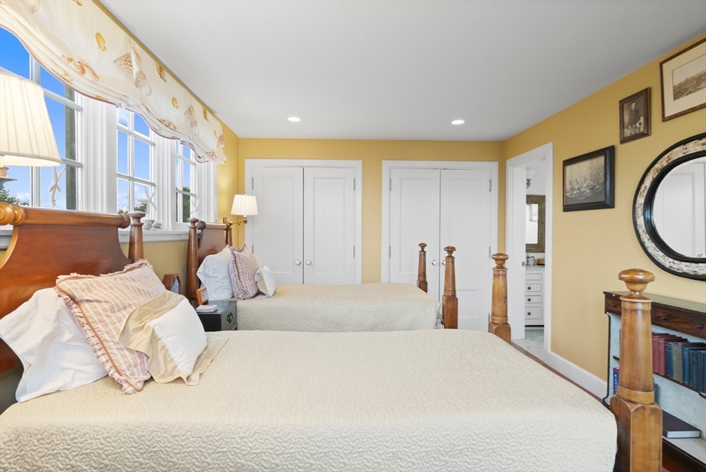 63 Baxter Road Nantucket, MA 02554 - Photo 21 of 21 a bedroom with bed and a couch