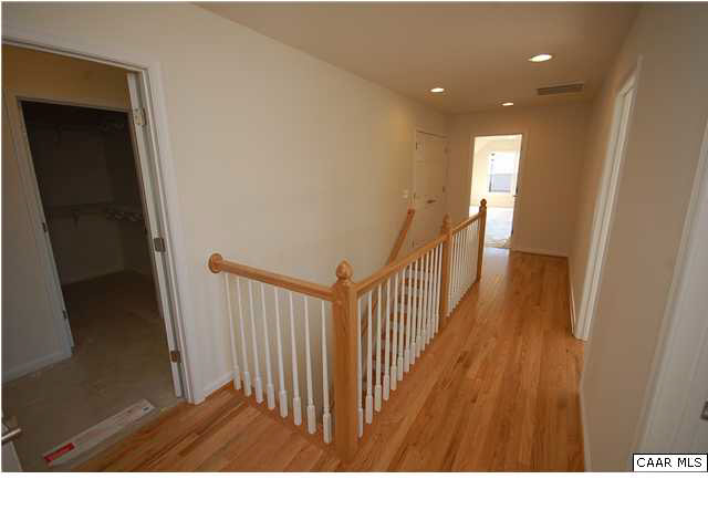 164 Wexford Ridge Road Ruckersville, VA 22968 - Photo 17 of 37 a open space with wooden floor and staircase