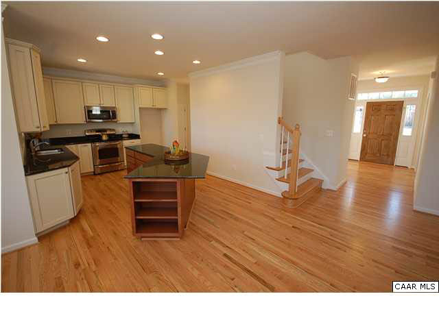 164 Wexford Ridge Road Ruckersville, VA 22968 - Photo 21 of 37 a kitchen with a refrigerator and a stove top oven