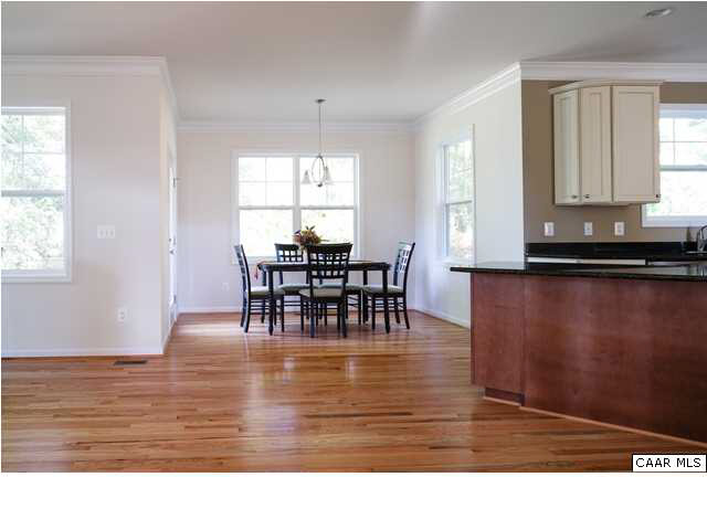 164 Wexford Ridge Road Ruckersville, VA 22968 - Photo 5 of 37 a living room with dining room furniture and wooden floor