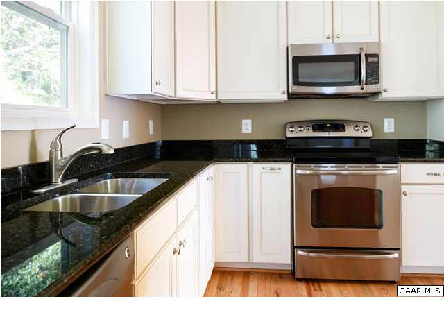 164 Wexford Ridge Road Ruckersville, VA 22968 - Photo 8 of 37 a kitchen with stainless steel appliances granite countertop a sink stove and microwave