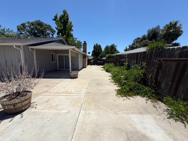2601 Temperate Court Modesto, CA 95358 - Photo 23 of 24 a view of backyard with small garden and wooden fence