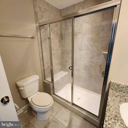 33 Iron Gate Road Sicklerville, NJ 08081 - Photo 11 of 16 a bathroom with a shower a toilet and a glass window