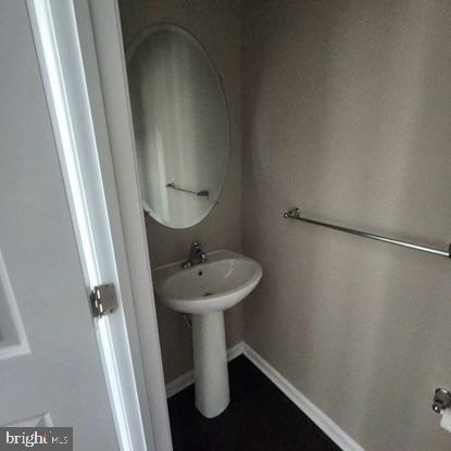 33 Iron Gate Road Sicklerville, NJ 08081 - Photo 13 of 16 a bathroom with a sink and mirror