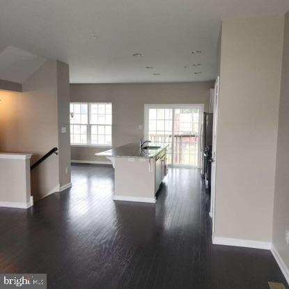 33 Iron Gate Road Sicklerville, NJ 08081 - Photo 5 of 16 a view of a room with wooden floor and a floor to ceiling window