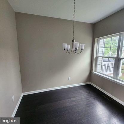 33 Iron Gate Road Sicklerville, NJ 08081 - Photo 6 of 16 an empty room with wooden floor and windows