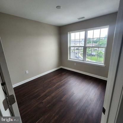33 Iron Gate Road Sicklerville, NJ 08081 - Photo 7 of 16 wooden floor in an empty room with a window