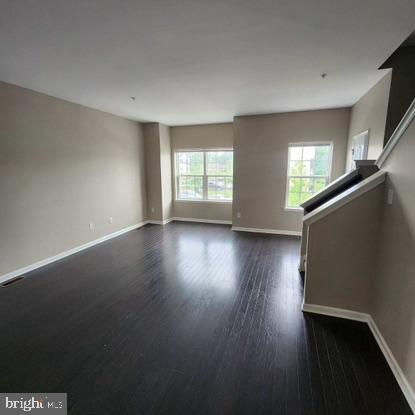 33 Iron Gate Road Sicklerville, NJ 08081 - Photo 8 of 16 an empty room with wooden floor and windows