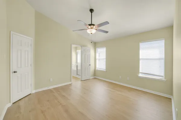a view of an empty room with a window