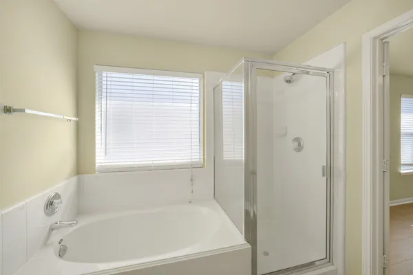a white bath tub sitting next to a window