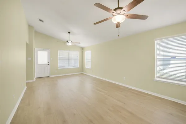 a view of an empty room with a window