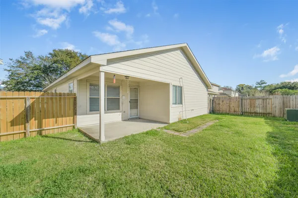 a view of a backyard with a garden and plants