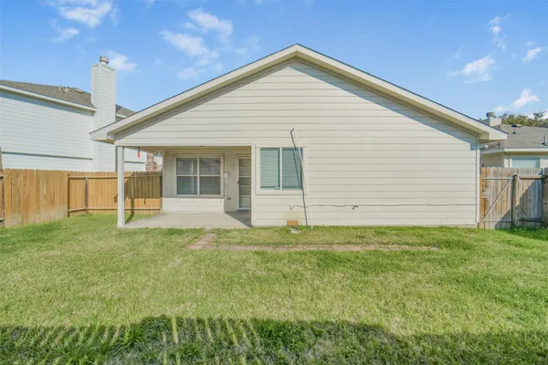 a view of a backyard of the house