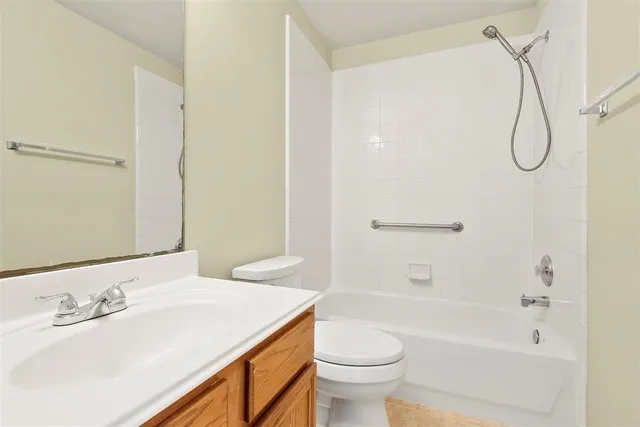 a bathroom with a sink a toilet and a bathtub