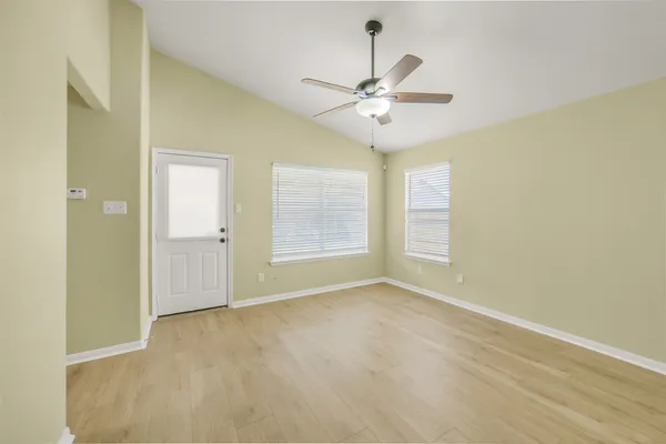 a view of an empty room with a window