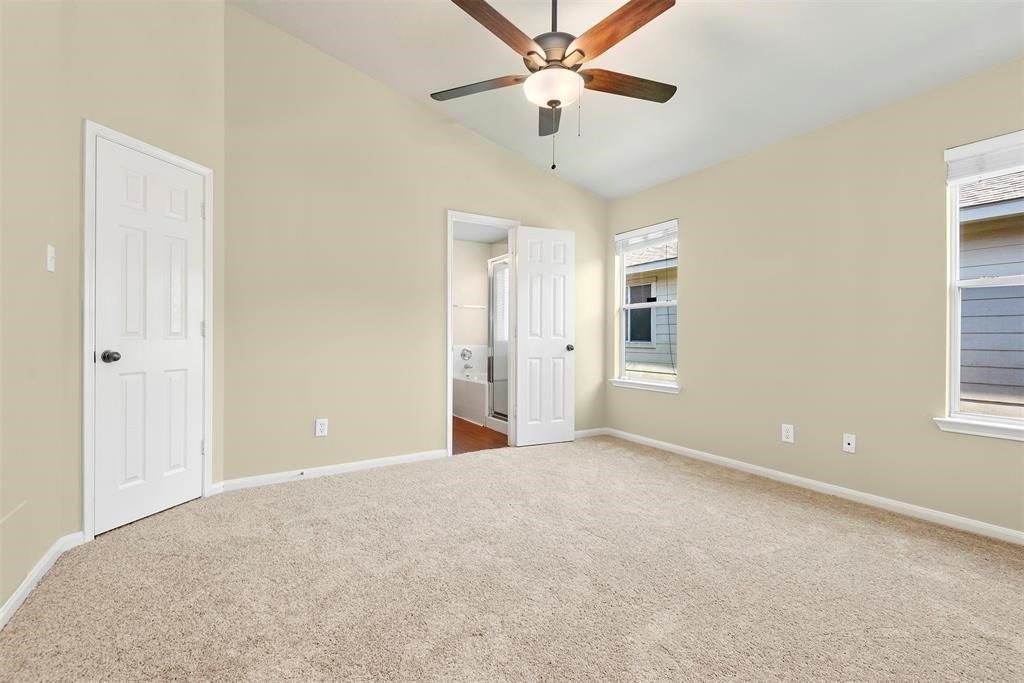 20231 Ribbonwood Point Court Tomball, TX 77375 - Photo 8 of 10 a view of an empty room with a window