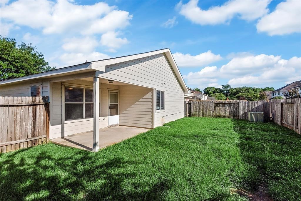 20231 Ribbonwood Point Court Tomball, TX 77375 - Photo 10 of 10 a view of a house with backyard