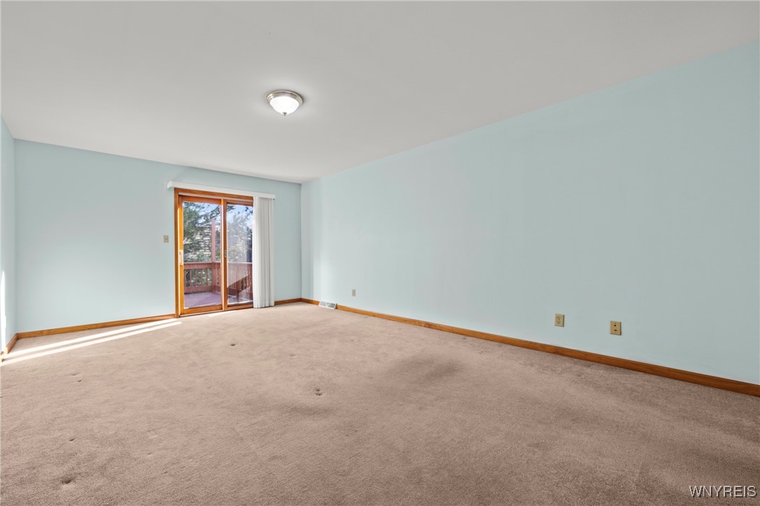 5225 Bridle Path Lane Lewiston, NY 14092 - Photo 16 of 44 large primary bedroom with slider to 2nd story dec