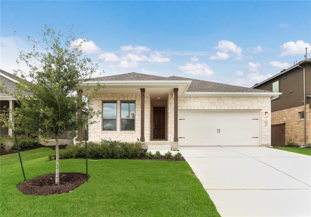 2233 Ringstaff Road Leander, TX 78641 - Photo 2 of 18 a front view of a house with a garden