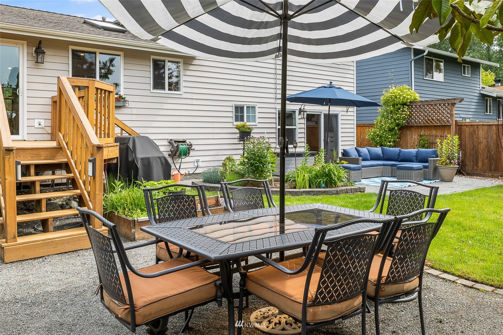 1228 234th Street Southwest Bothell, WA 98021 - Photo 29 of 34 a patio with table and chairs