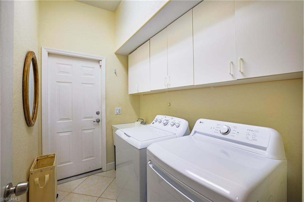 5235 Malvern Court Naples, FL 34112 - Photo 22 of 28 a utility room with dryer and washer