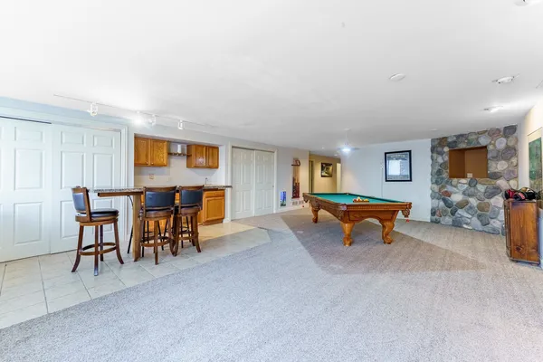 a view of a livingroom with furniture and a flat screen tv