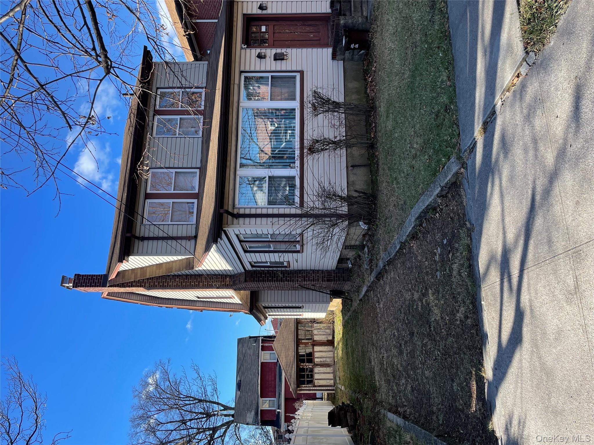40-08 204th Street Queens, NY 11361 - Photo 2 of 2 a view of a large house with a yard