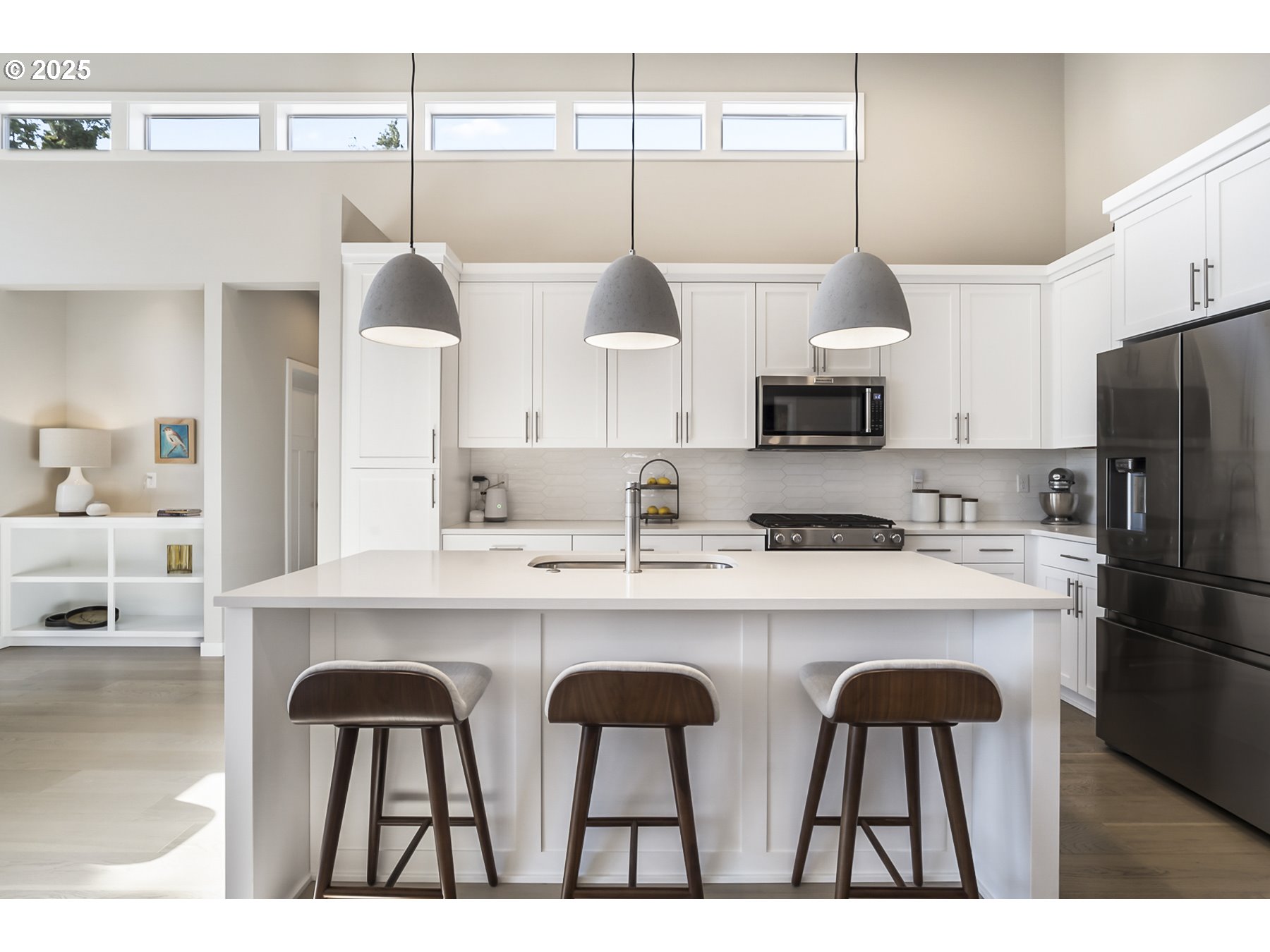 63125 Iner Loop Bend, OR 97701 - Photo 5 of 29 a kitchen with refrigerator a sink and cabinets