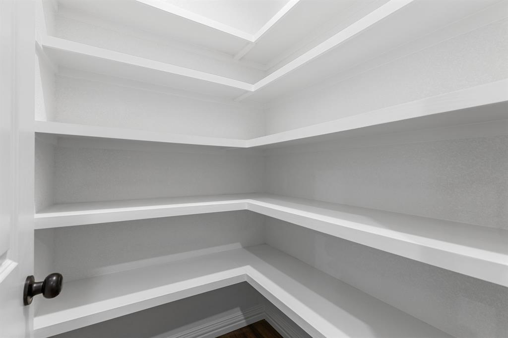 4695 Sisk Road Wichita Falls, TX 76310 - Photo 15 of 32 a storage room with empty racks