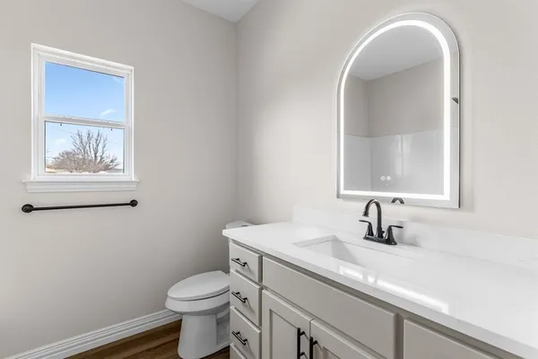 a bathroom with a bath tub with a shower