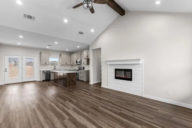 a view of kitchen with cabinets and wooden floor