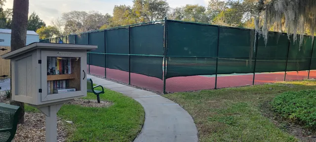 an outdoor sitting area with golf course